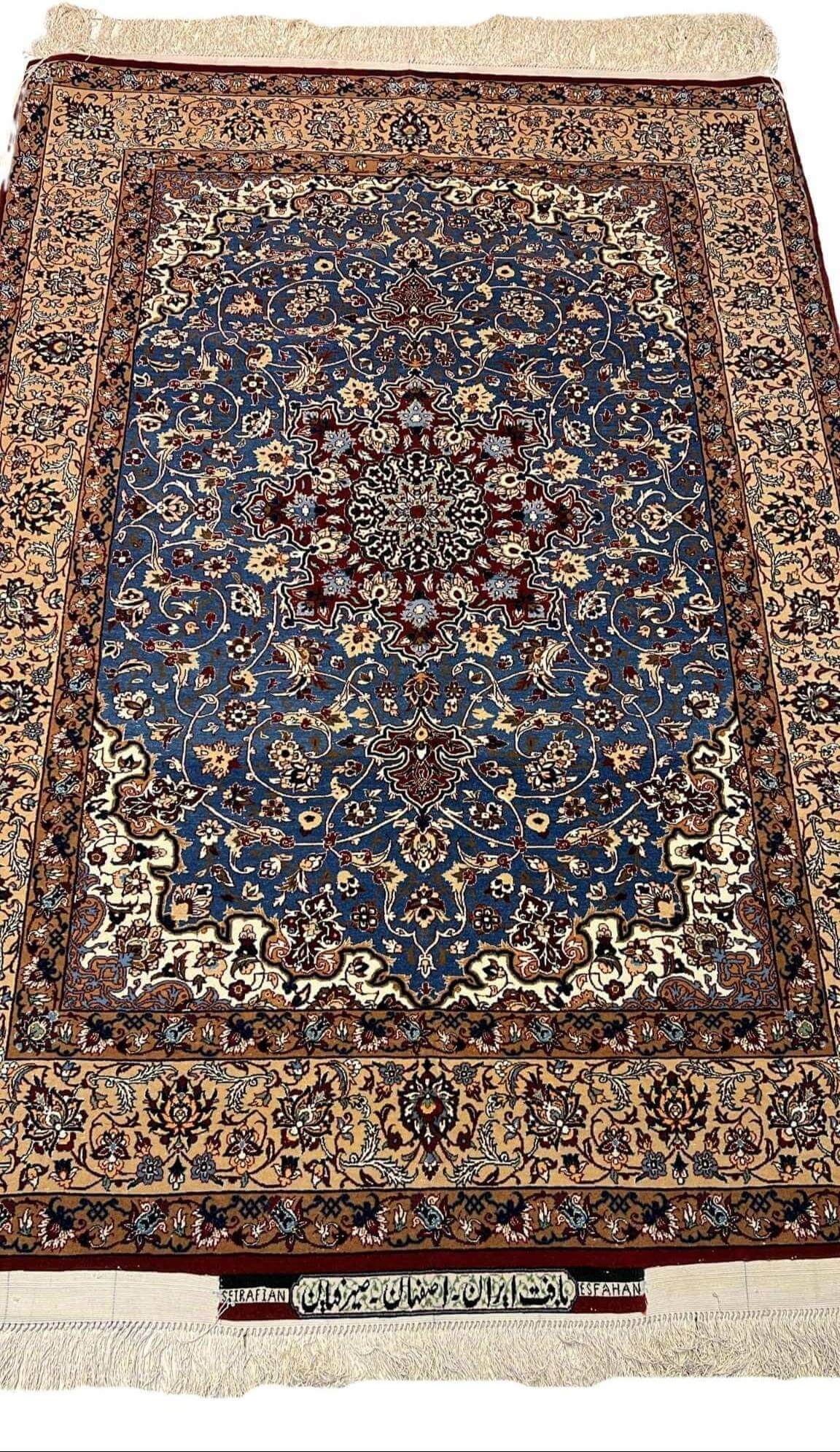 "Front view of an authentic Seirafian Persian rug with intricate floral and medallion design, handwoven with silk and wool in Isfahan by Master Hassan Seirafian."